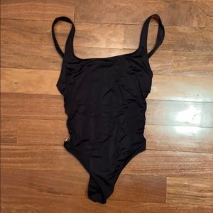 Black one piece with gold ring sides